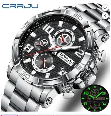 a close up of a watch on a white background with a green glow