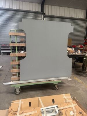 a large screen in the middle of a warehouse