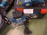 a picture of a tool box with a corded sander and other tools