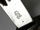 a close up of a knife that has a sticker on it