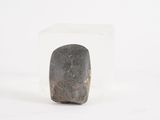 a rock that is sitting inside of a glass block