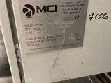 a label on the back of a machine that says omc