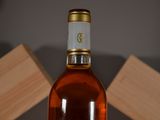 a bottle of wine that is sitting on a table