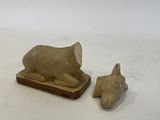 figurines of a cat and a mouse on a white surface