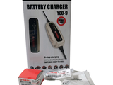 a box with a battery charger in it on a white background