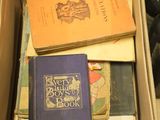 a box full of books that are sitting on the floor