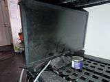 a black stove with a can of soda on top of it