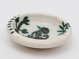 a white bowl with a black and white design on it
