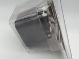 a close up of a plastic object on a white surface