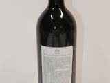 a bottle of wine that is sitting on a table
