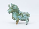 statue of a bull made of green clay on a white background