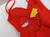 an image of a close up of a red bra top on a table