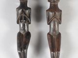 pair of carved wooden figures of a man and a woman