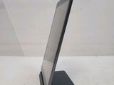 a tablet computer sitting on a stand on a white surface