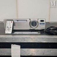 an image of a projector sitting on top of a metal case