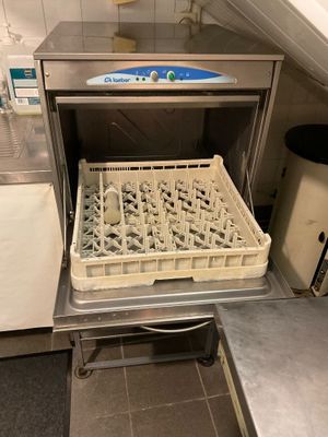 an image of a dishwasher with dirty dishes in it