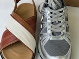 two pairs of shoes are sitting next to each other on a table