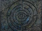 peinture représentant un motif circulaire avec une croix au centre