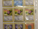 a lot of pokemon cards that are on the table