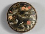 an image of a compact case with flowers on it