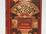 un livre rouge avec des lettres dorées posé sur une surface blanche
