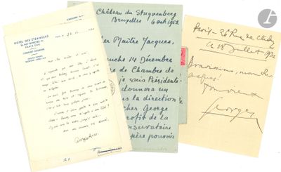 several old letters are sitting next to each other on a white surface