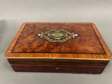 an image of a wooden box with a decorative design on it