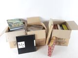 many boxes of books sitting on a white surface