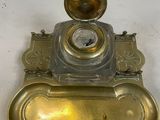 a brass plate with a clock on top of it