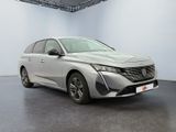 the front view of a silver car in a white room