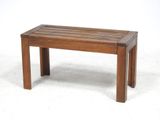 a wooden bench that is sitting on a white surface