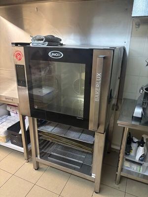 a small oven that is in the middle of a kitchen