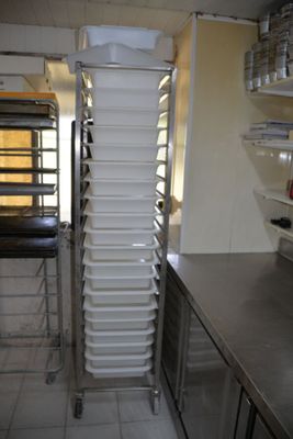 a picture of a commercial kitchen with a lot of dishes on the shelves