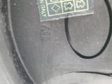 a close up of a car ' s tire with a sticker on it
