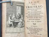 an open book with a picture of a man and woman sitting at a table