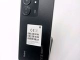 an image of a close up of the back of a black phone
