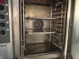 an open oven that is sitting in a kitchen