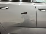 a white car with a sticker on the side of it