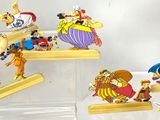a lot of cartoon figurines on display in a case