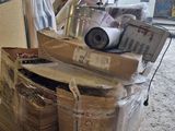 a pile of boxes on a pallet in a warehouse