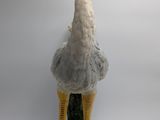 a large bird that is standing on a pedestal