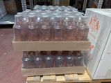 bottles of wine are stacked on a pallet in a warehouse