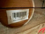 a close up of a wooden box with a label on it