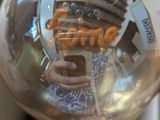 a person holding a light bulb with a picture in it