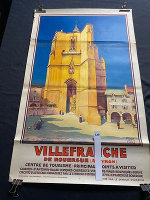 posters on a table in front of a black table cloth