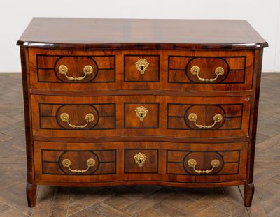 an image of a chest of drawers on a parquet floor