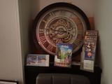 a clock that is on the wall next to a chair