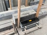 a pile of pallets sitting on the ground next to a pile of wood