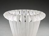 a white vase that is sitting on a table
