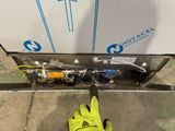 a glove that is on the ground next to a box